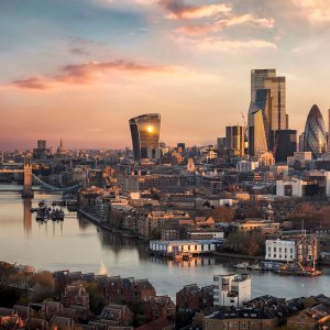 The skyline of London city with Tower Bridge and financial district skyscrapers during sunrise, England, United Kingdom